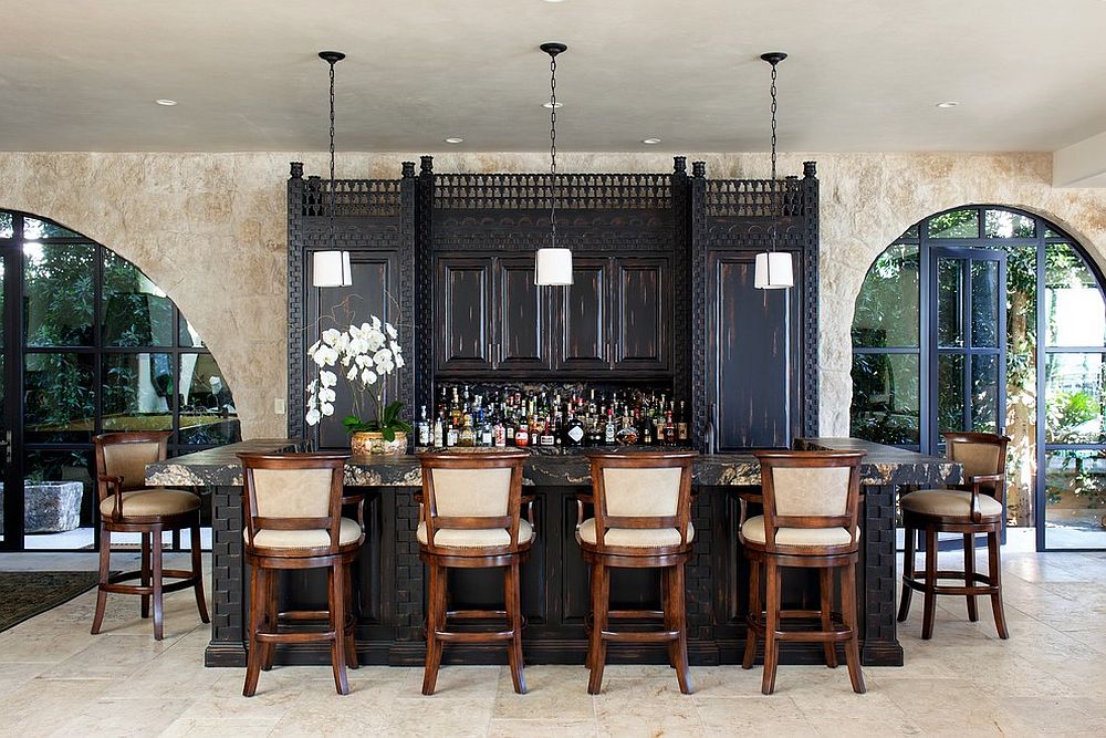 Custom cabinetry for the casual and inviting Mediteranean home bar