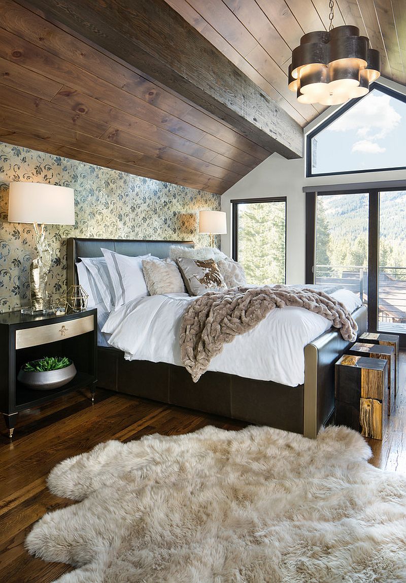 Design of the ceiling and extensive use of wood brings rustic vibe to this modern bedroom