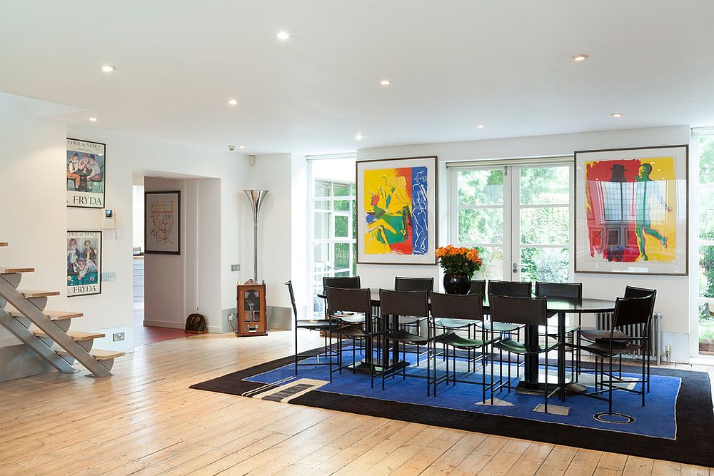 Delineate the dining room in open plan living using blue and black