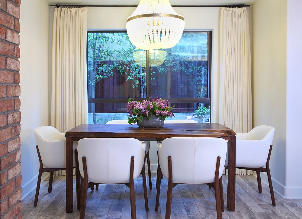 Exquisite little dining room with handmade walnut chairs and ample natural light