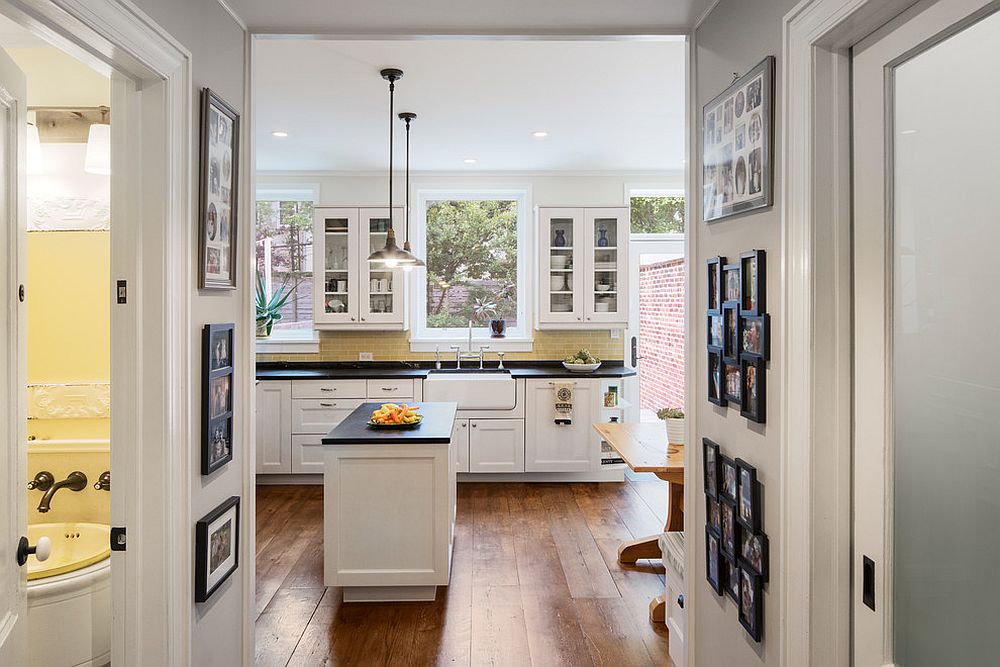 Gallery walls welcome you into this spacious traditional kitchen