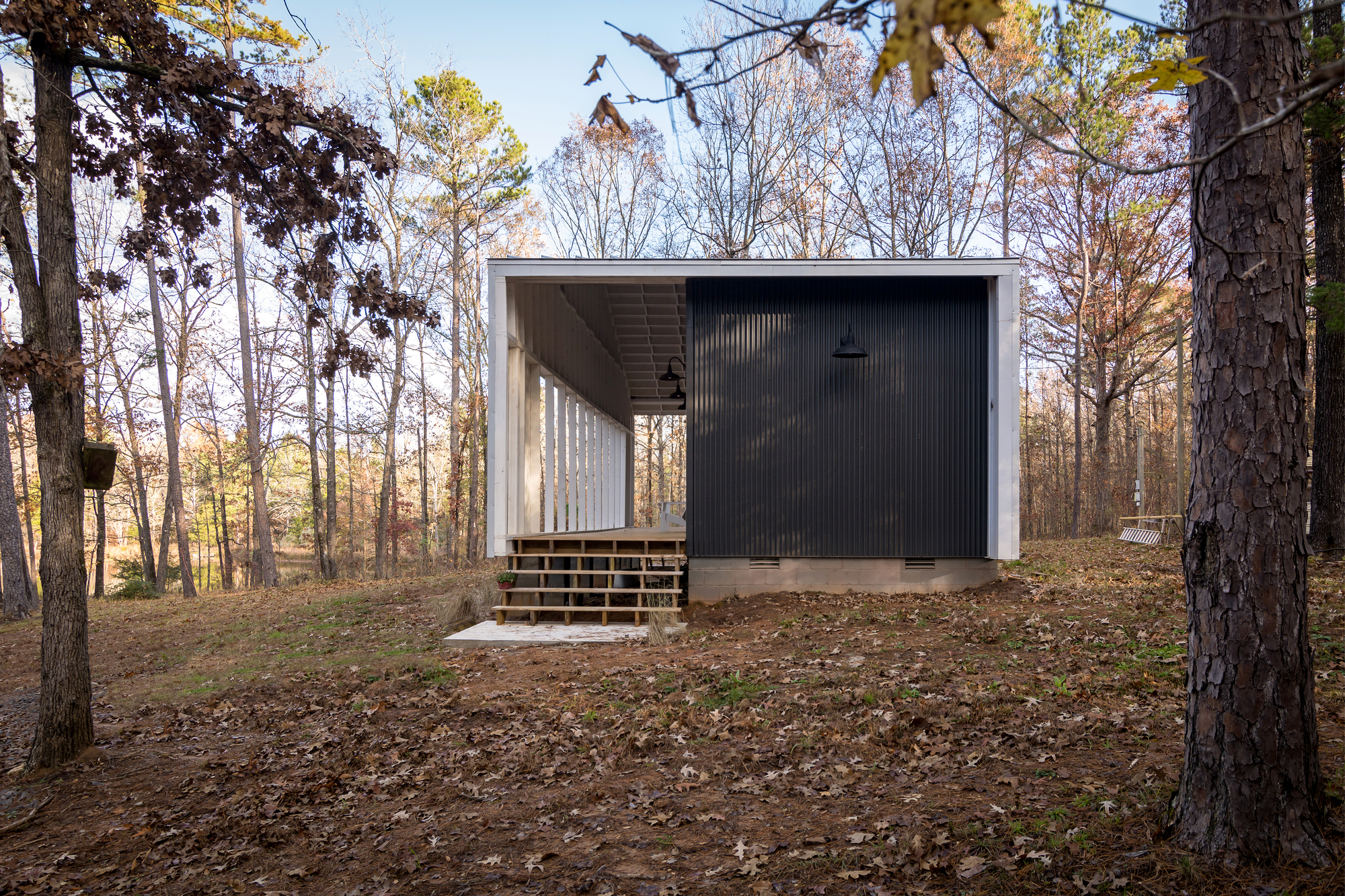 Galvanized standing seam metal panels shape the exterior of the tiny house