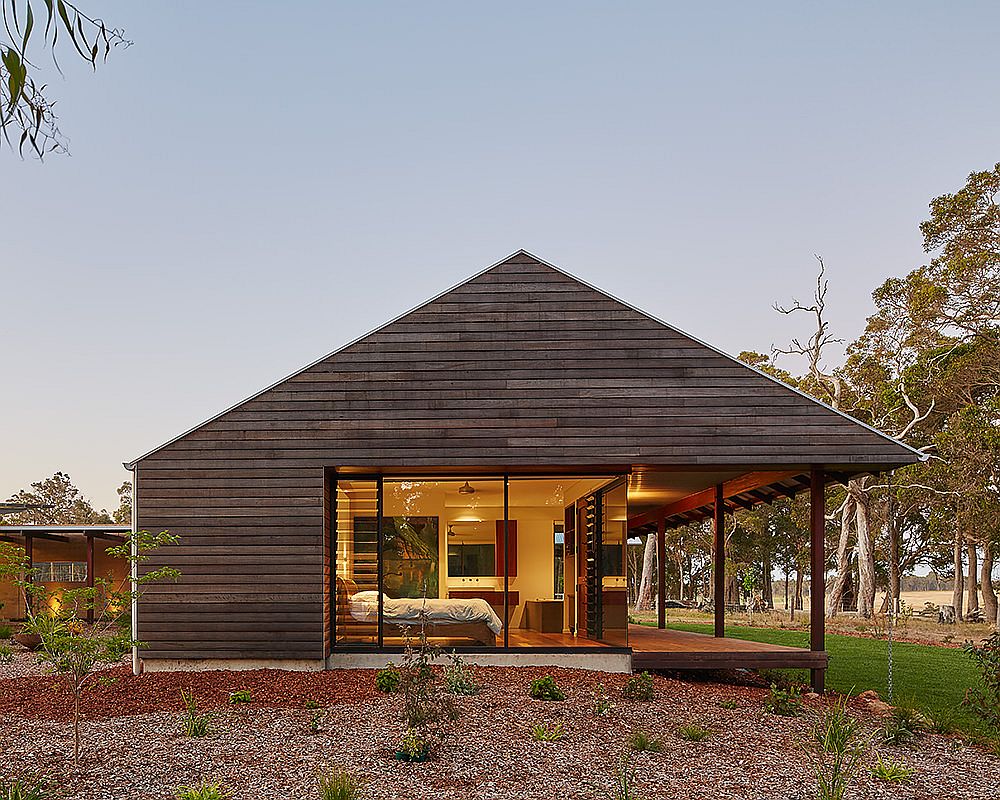 Glass walls open up the exterior to the private bedroom