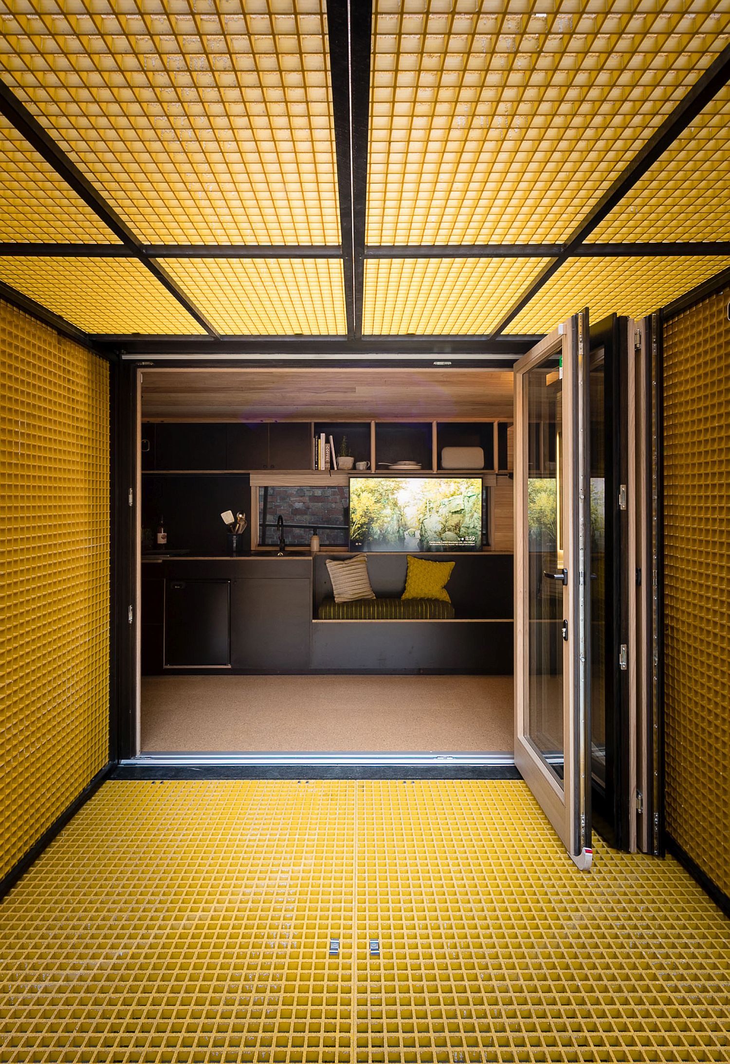 Gridded yellow panels create unique sun shades which can be lowered using automated hydraulics