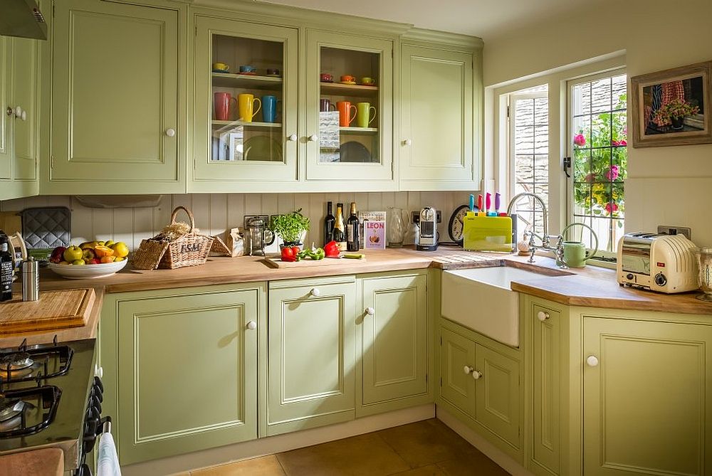 Kitchen brings natural light into the small farmhouse kitchen in pastel green