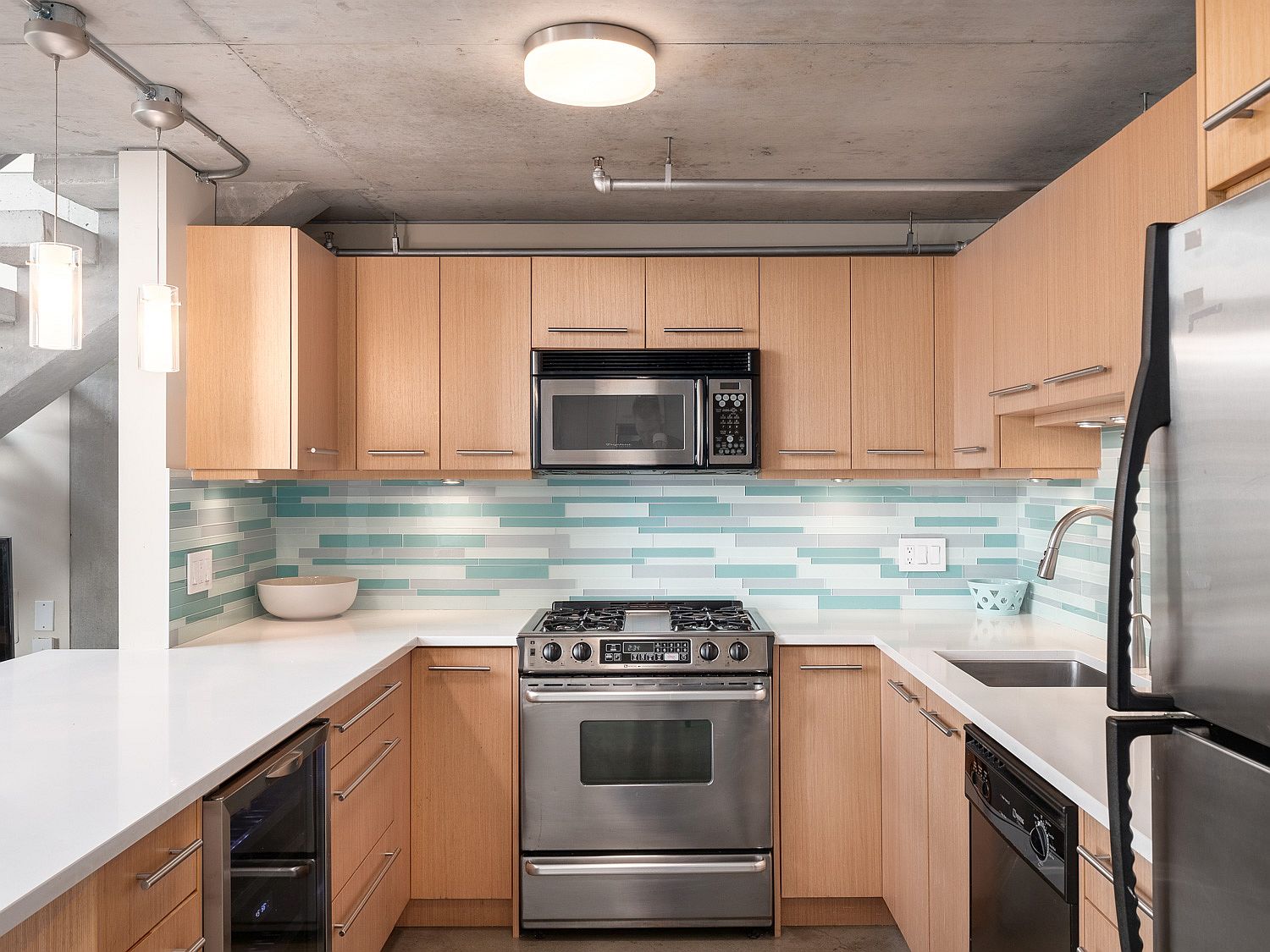 Kitchen with wooden cabinets, quartz countertops and smart layout