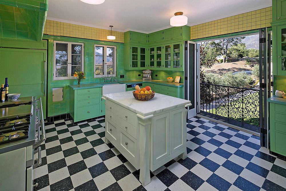 Mediterranean kitchen in green with black and white floor tiles