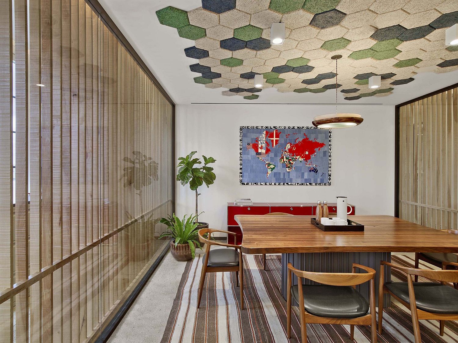 Meeting-room-with-hexagonal-tiles-on-the-ceiling-and-wooden-louvers-for-the-giant-window