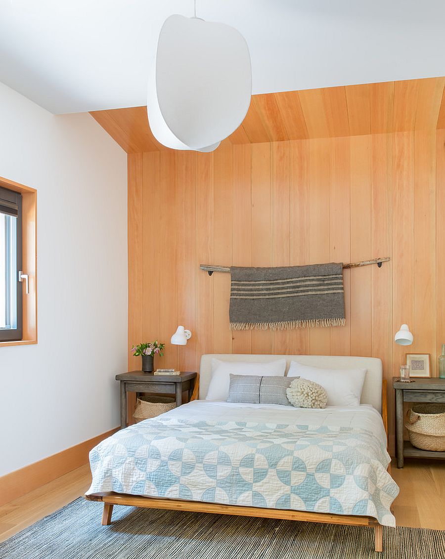 Modern rustic bedroom with a fabulous wooden accent wall in the backdrop