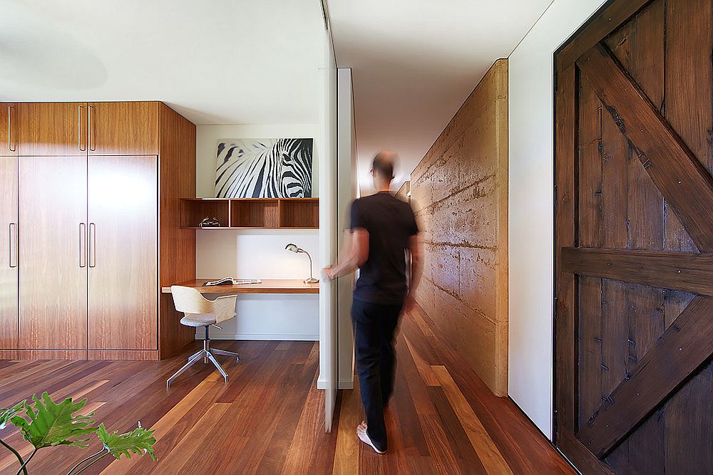 Oiled timber flooring inside the house adds to its passive cooling techniques