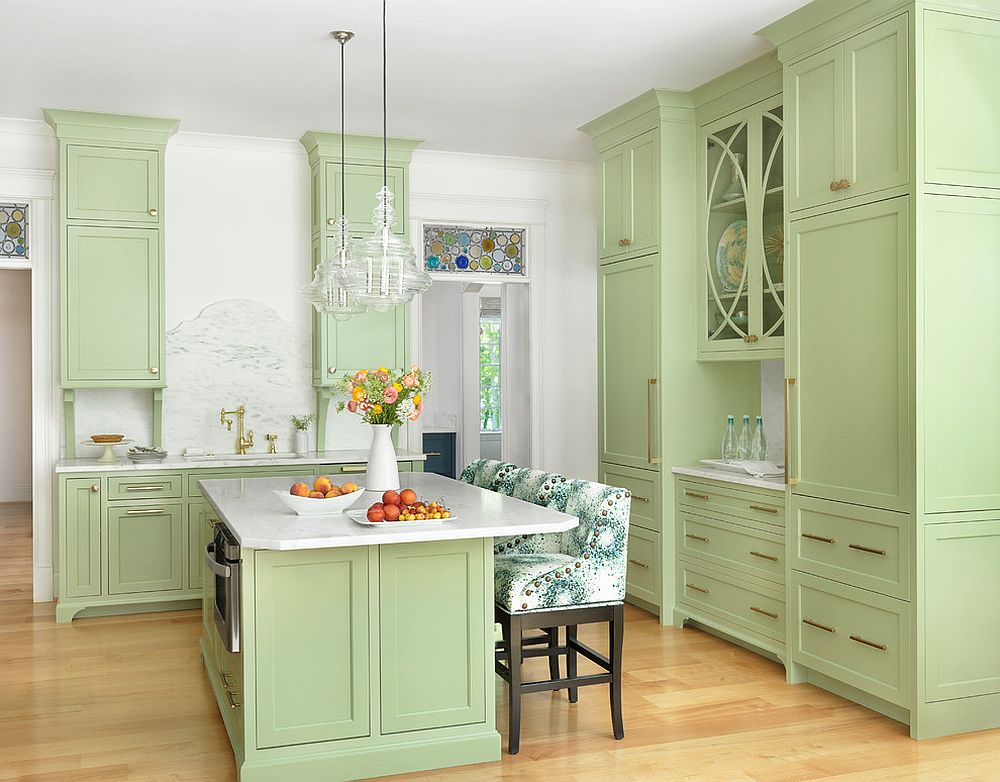 Pastel green gives a lovely, bright aura to the transitional kitchen