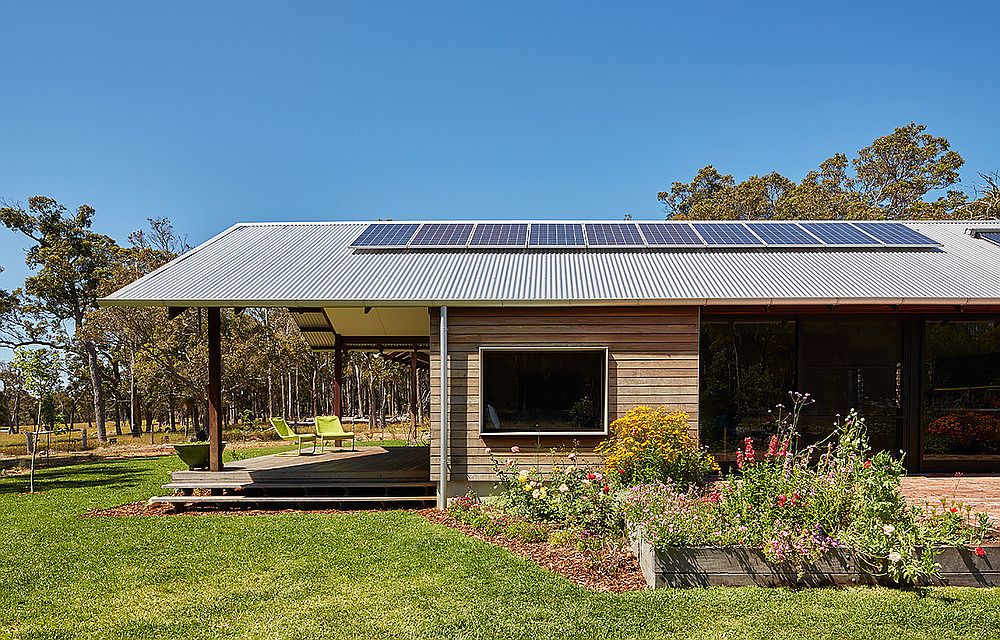 Photovoltaic panels that power the farmhouse sit on the roof