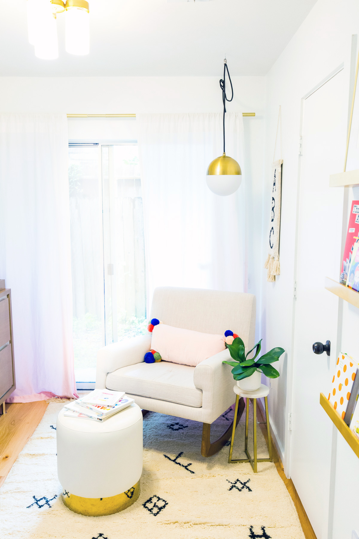 Pom poms and tassels in a nursery by Sugar and Cloth