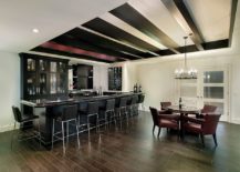 Posh-black-leather-stools-for-the-built-in-home-bar-in-the-basement-217x155