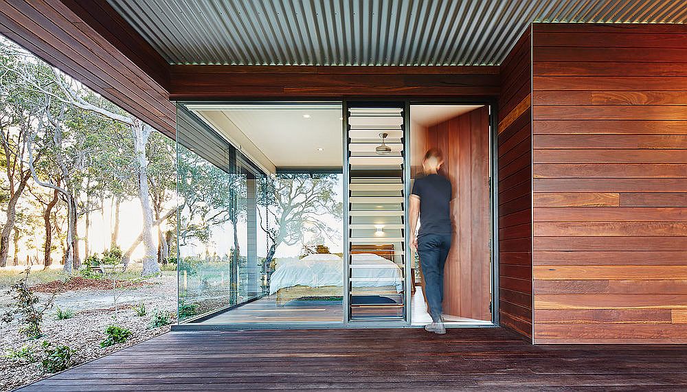 Rammed earth and wood give the house a naturally cool frame