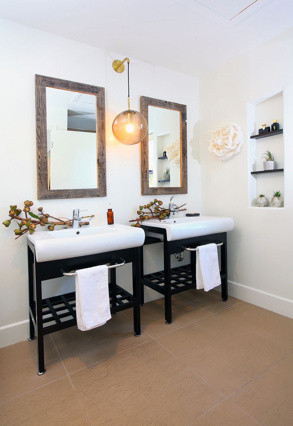 Recycled twin vanities in the bathroom coupled with vintage Danish pendant light