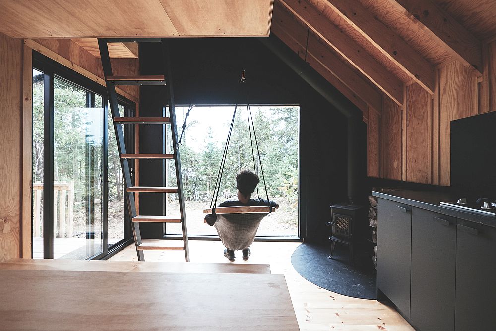 Relaxing interior and covered deck of the cabin with a view of the outdoors