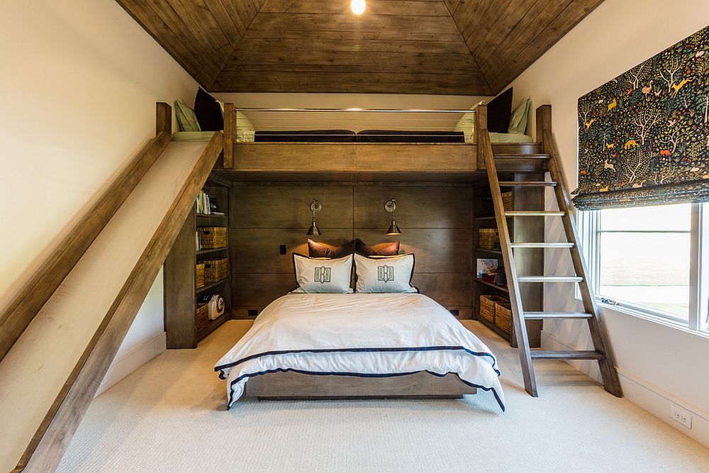 Rustic bedroom with loft level bed and a cool slide