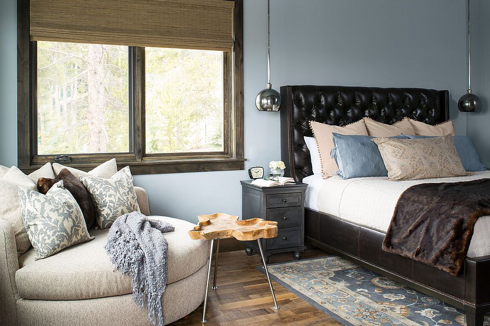 Small rustic chic bedroom in blue with decor in black