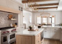 Smart-farmhouse-kitchen-in-white-and-wood-with-beautiful-tiled-backsplash-217x155