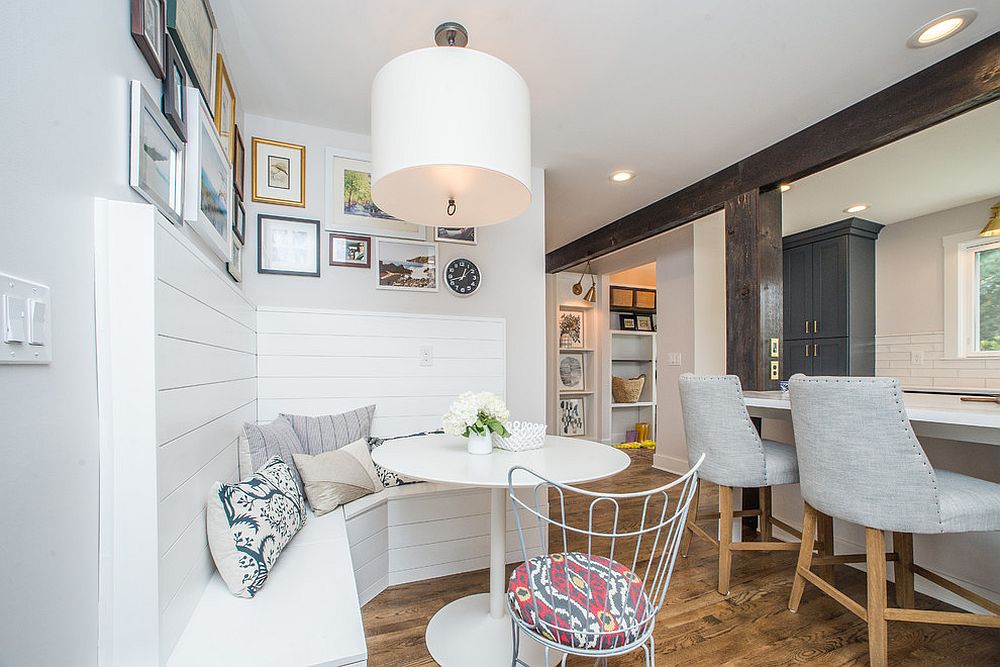 Space above the banquette breakfast nook used to add gallery wall to the kitchen