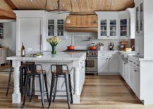 Spacious-and-well-lit-farmhouse-style-kitchen-in-white-and-wood-217x155