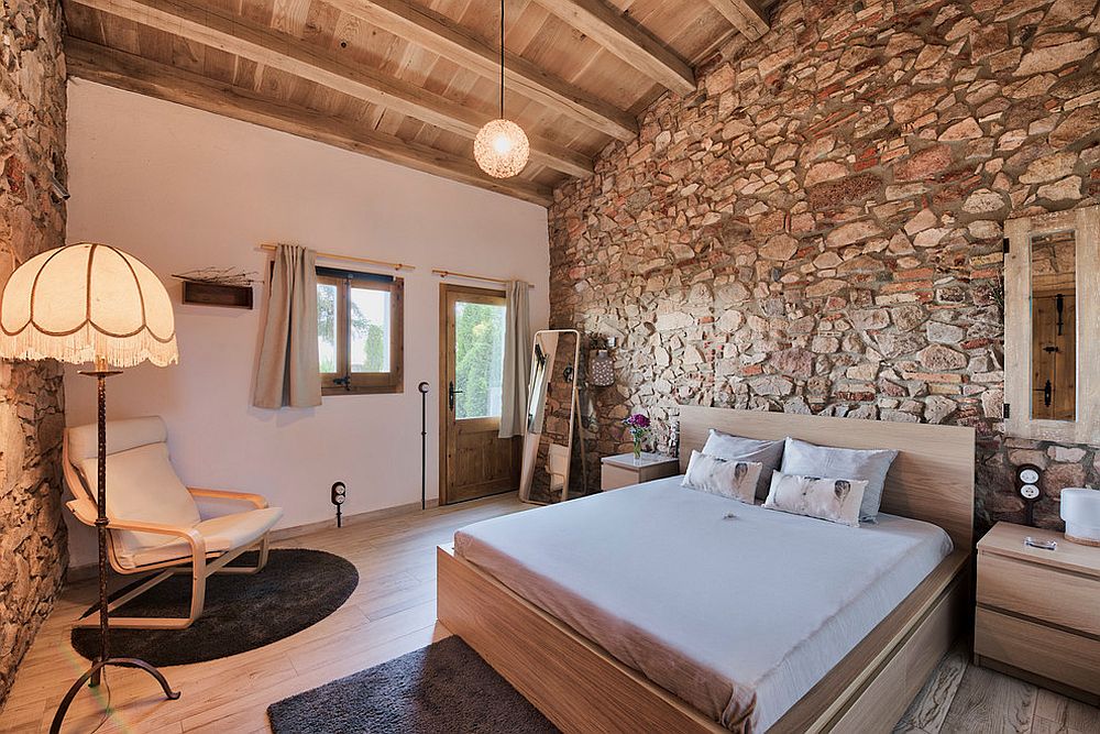 Stone-walls-give-the-rustic-bedroom-an-air-of-authenticity