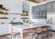 Stunning-farmhouse-kitchen-in-wood-and-white-with-a-ceiling-that-is-a-showsopper-217x155
