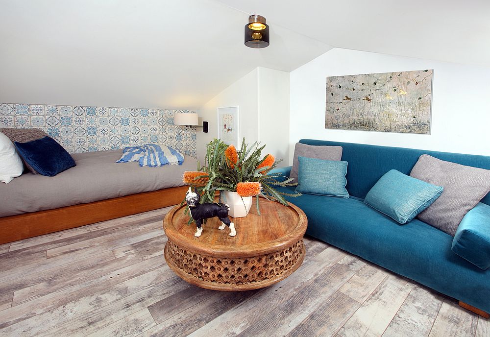 Tiny-attic-converted-into-a-smart-and-cool-sitting-area-in-white