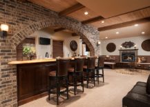 Traditional-basement-bar-with-brick-face-and-bar-stools-in-leather-217x155