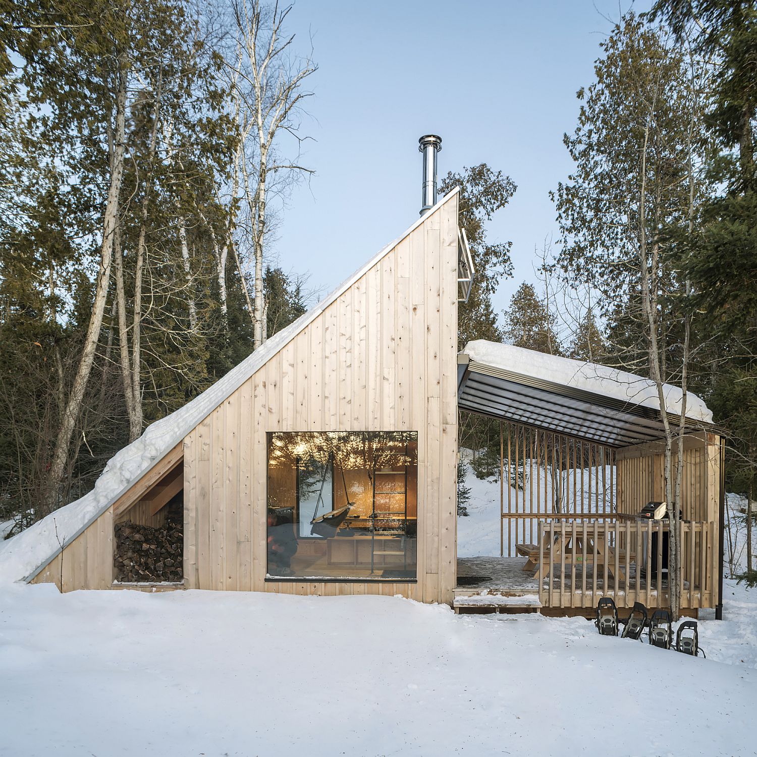 Triangular frame of the cabin is inspired by A-frame homes of the 50's