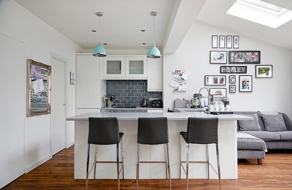 White and gray kitchen with skylight and a smart gallery wall