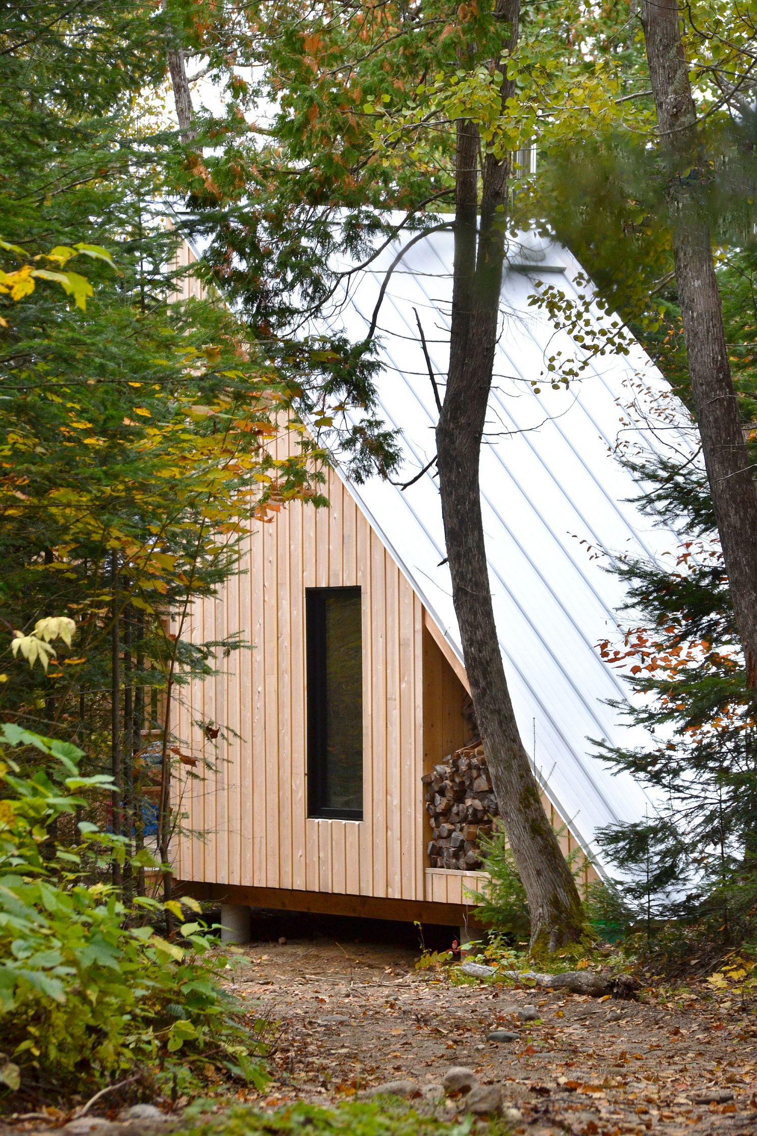 Wood and metal exterior of the micro-shelter in woods