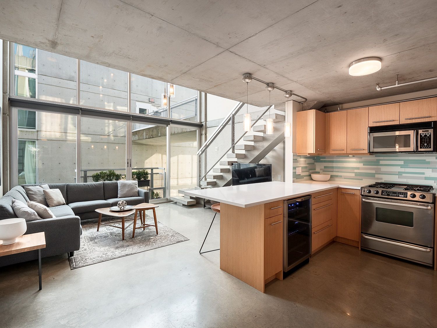 Wood cabinetry and new-age appliances for the small kitchen