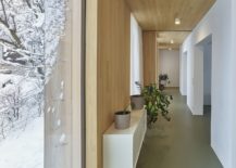 Wood-draped-walls-inside-the-house-make-a-cozy-visual-impact-217x155