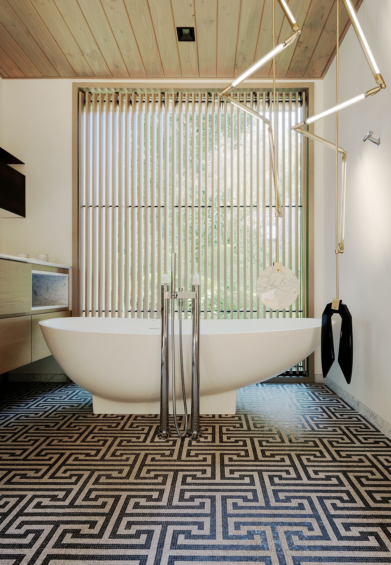 Bathroom-in-white-with-unique-floor-tiles-and-wooden-ceiling