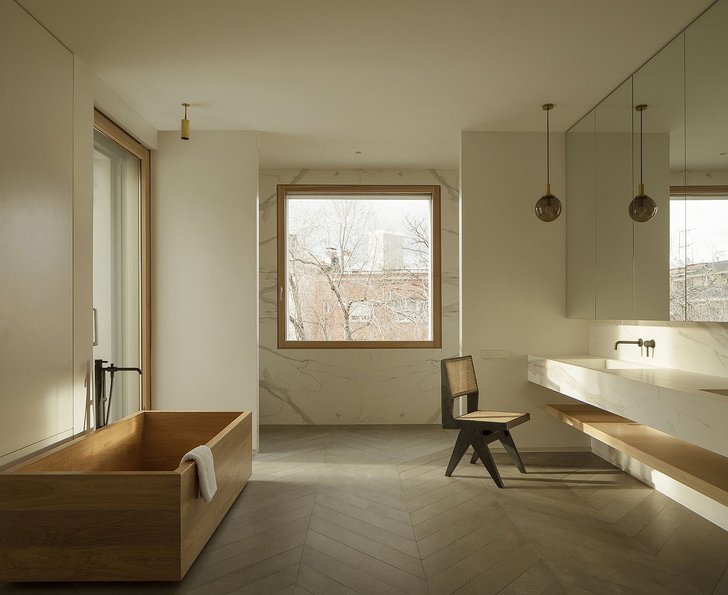 Beautiful bathroom with marble and wood and lovely natural lighting