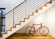 Beautifully-lit-space-underneath-the-stairway-for-the-bicycle-217x155