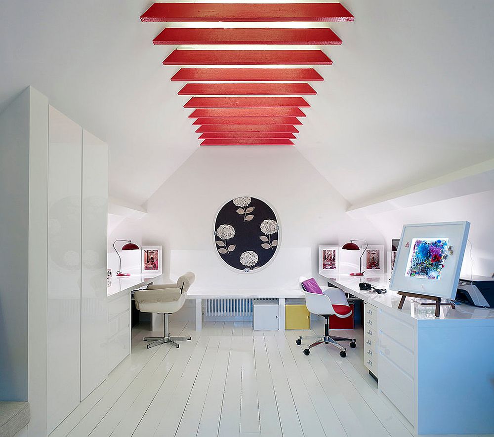 Bright-and-modern-ceiling-beams-in-red-shield-the-skylight-above-them-in-an-eye-catching-manner