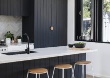 CHarred-and-oiled-cypress-can-be-found-in-the-modern-white-kitchen-of-the-house-as-well-217x155