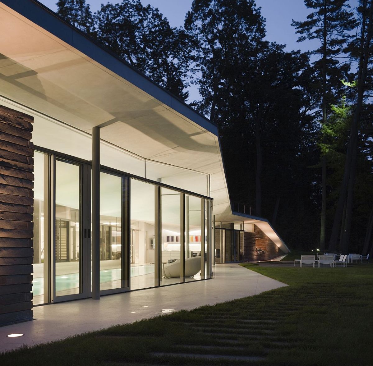 Cool white lighting takes over inside the pavilion after sunset