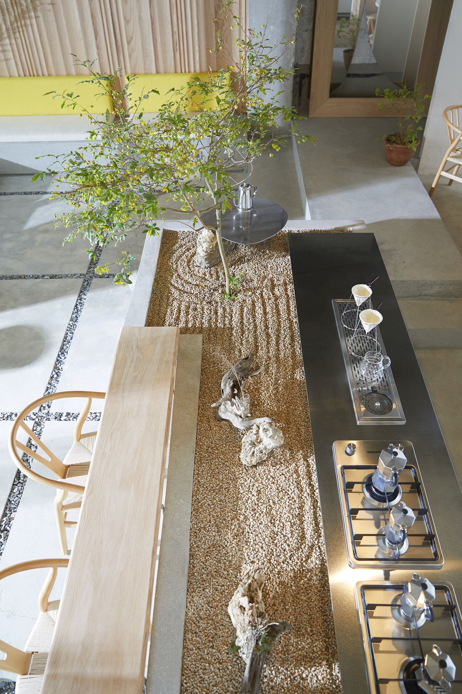 Gravel-filled central area along with greenery inside the house
