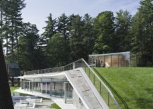 Green-roof-and-contours-of-the-pavilion-ensure-it-feels-like-a-natural-addition-217x155