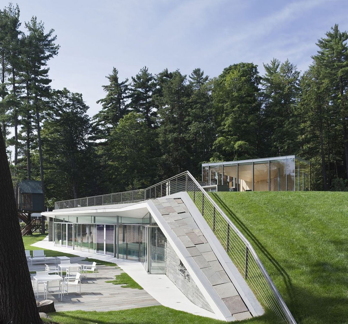 Green roof and contours of the pavilion ensure it feels like a natural addition