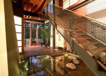 Indoor-pond-under-the-staircase-is-a-showstopper-217x155