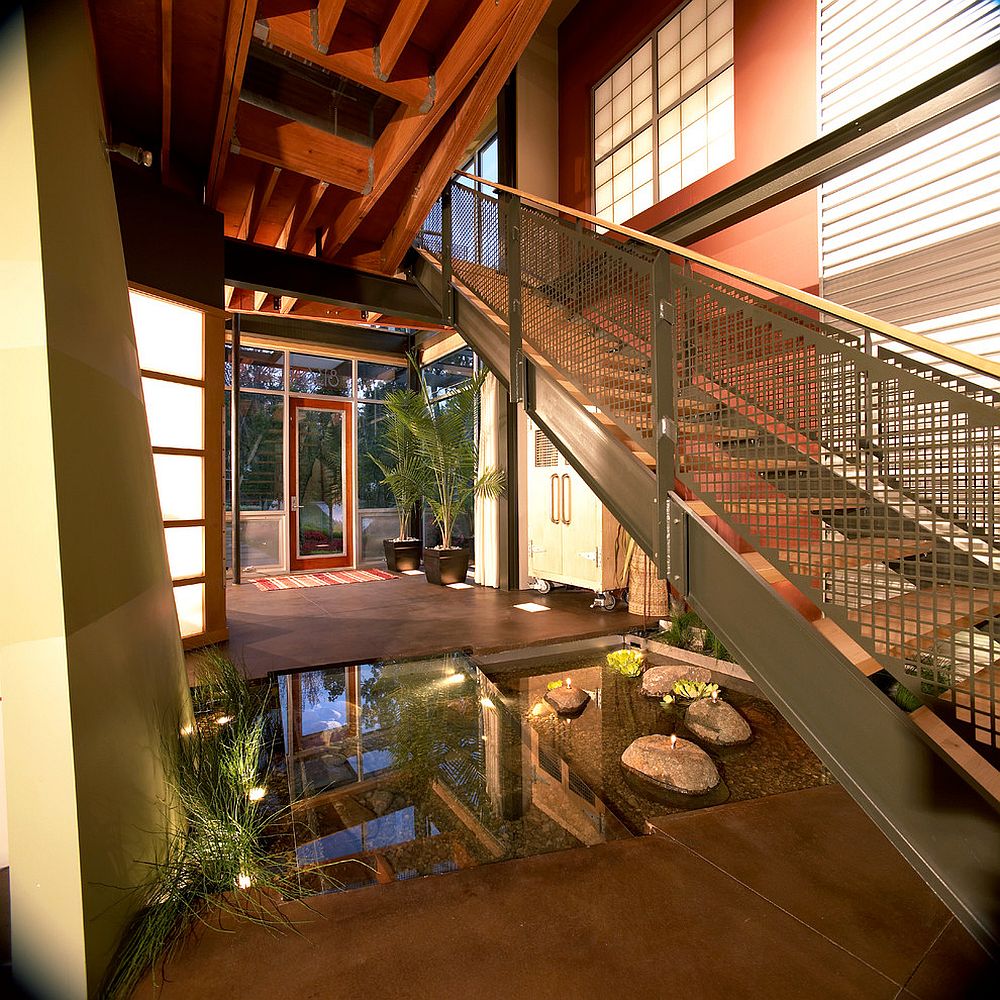 Indoor pond under the staircase is a showstopper