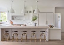 It-is-bar-stools-that-add-visual-contrast-to-the-all-white-kitchen-217x155