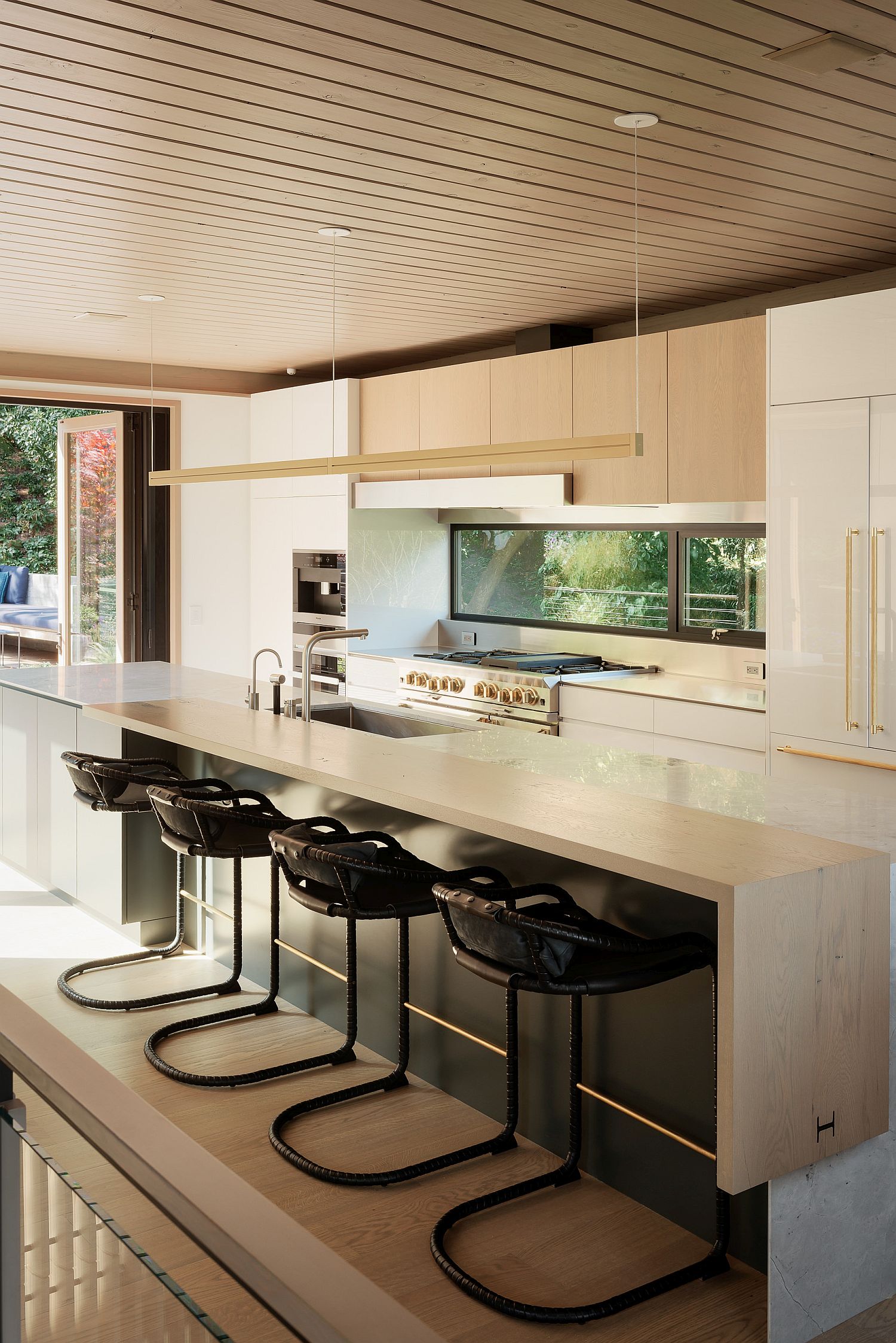 Kitchen of the Twin Peaks Residence with wood and white palette