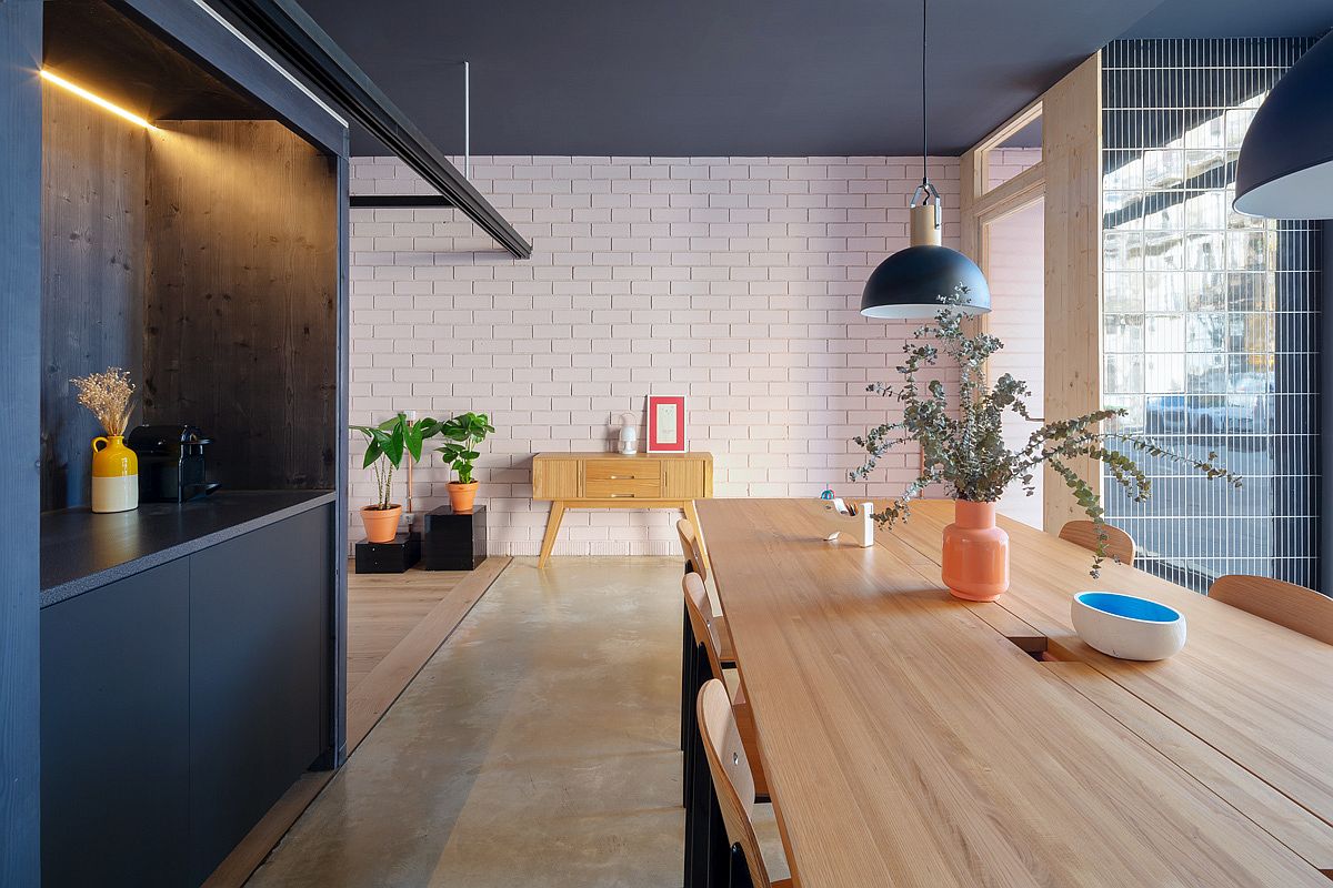 Large-gray-pendant-subway-tiles-and-wooden-surfaces-inside-the-office
