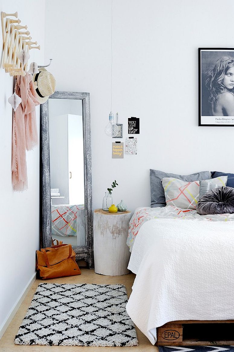 Minimal bedroom with mirror in corner and backdrop in white